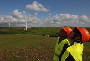 Images of visitors at a community open day at the Armistead Wind Farm